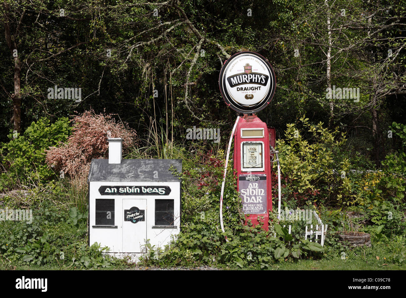 Old gas pump with advertising for Murphy's Draught beer, gas station in Lauragh, Beara Peninsula, County , Ireland Stock Photo