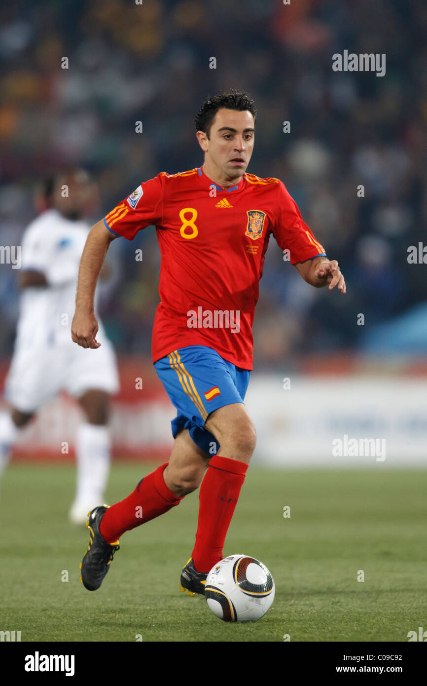 Xavi of Spain drives the ball against Honduras during a 2010 FIFA World Cup Group H match June 21, 2010 at Ellis Park. Stock Photo