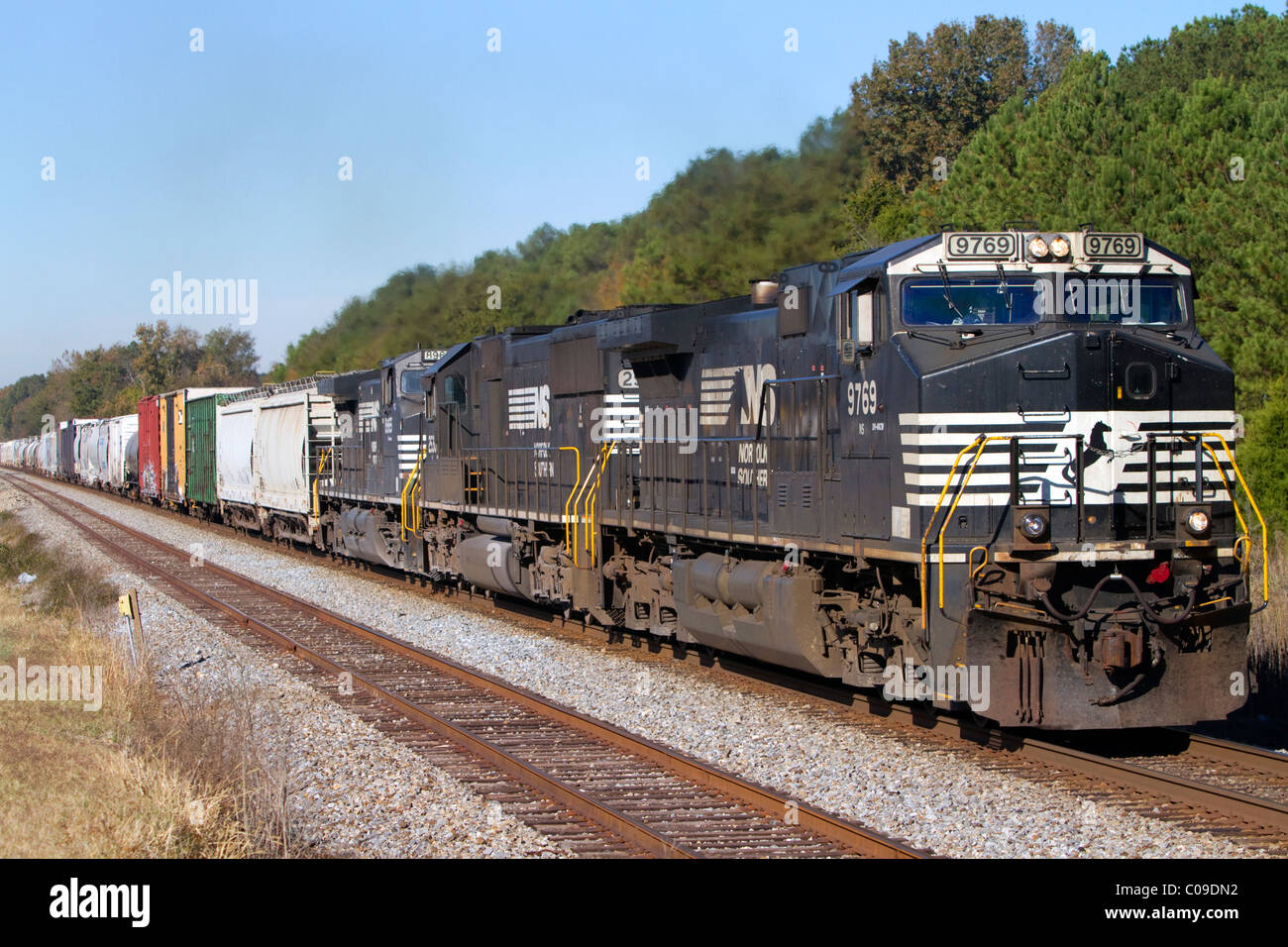 Norfolk Southern Railway locomotive traveling along Highway 72 west of Mussel Shoals, Alabama, USA. Stock Photo