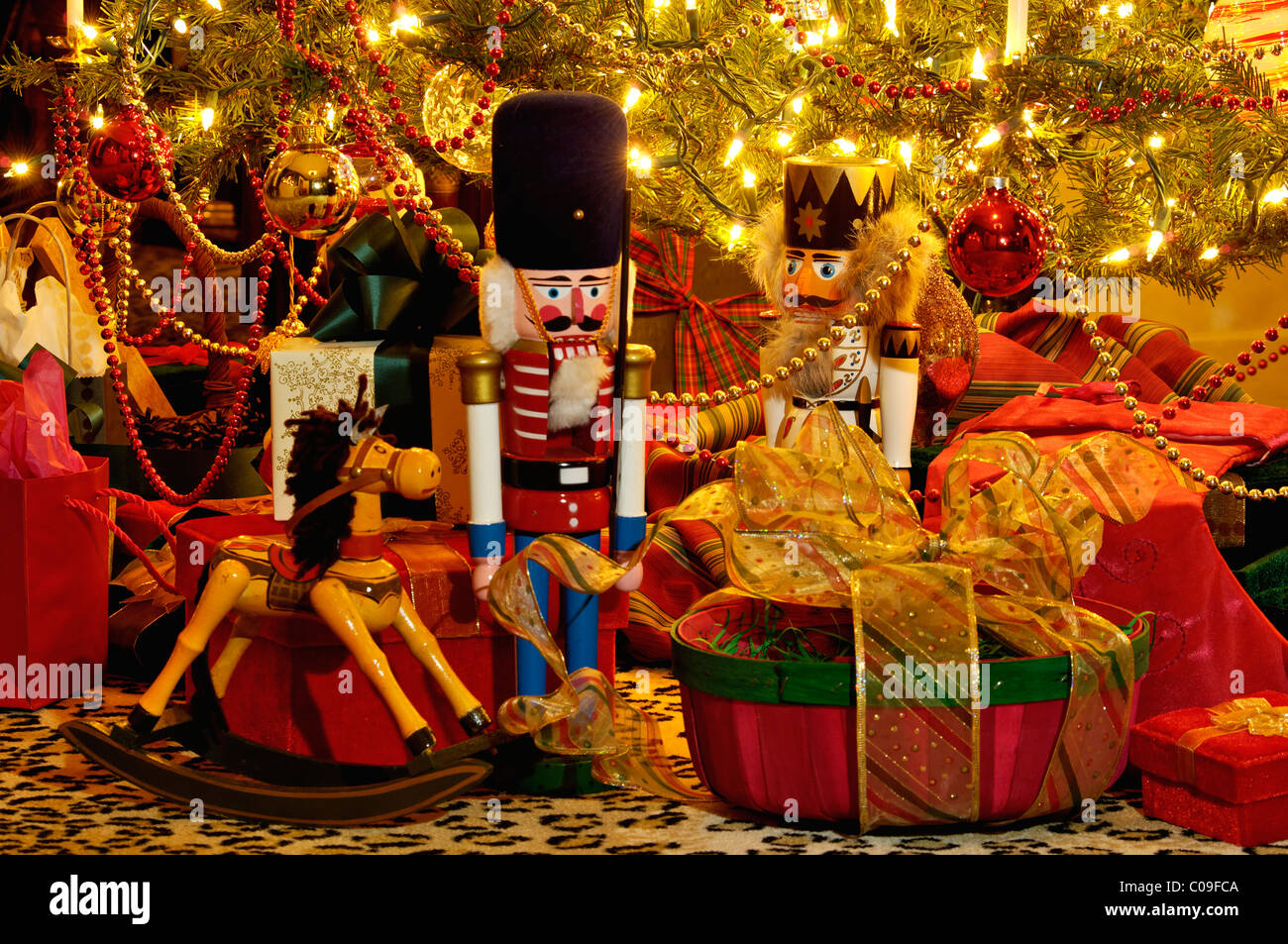 Nutcrackers, Hobby Horse and Gifts under Victorian Christmas Tree in New Albany, Indiana Stock Photo