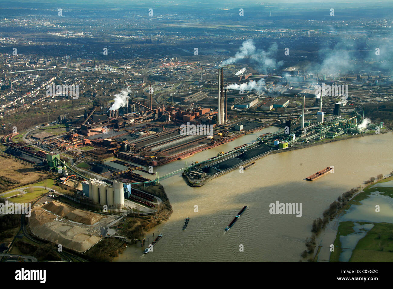 Aerial view, construction site, bulk ships, unloading of coal, ThyssenKrupp Steel, port Walsum, Duisburg, Ruhrgebiet region Stock Photo