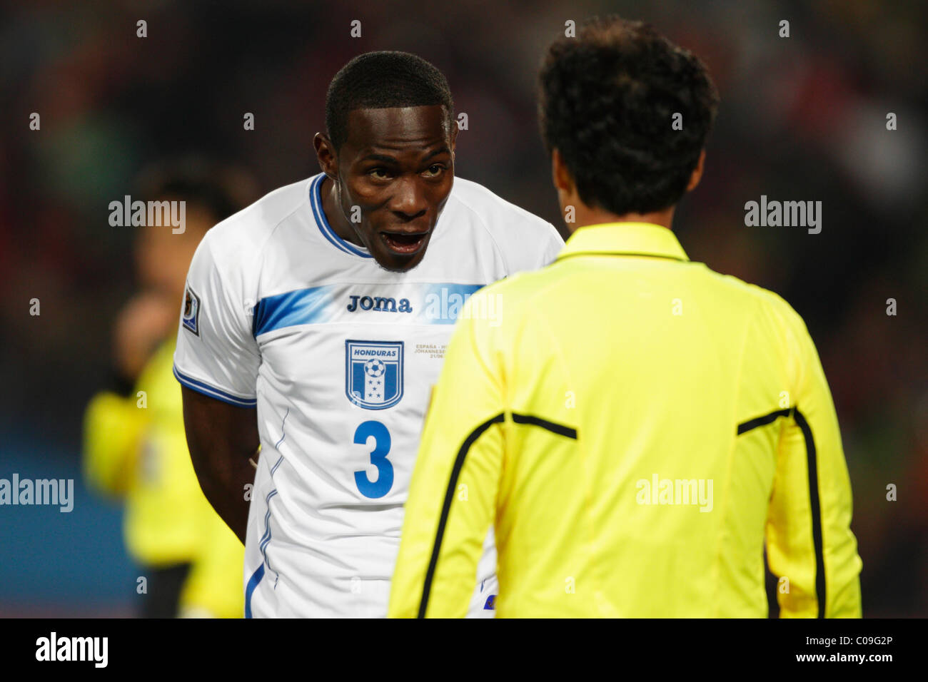 Maynor Figueroa of Honduras (3) argues a call with the linesman during a 2010 FIFA World Cup Group H match against Spain. Stock Photo