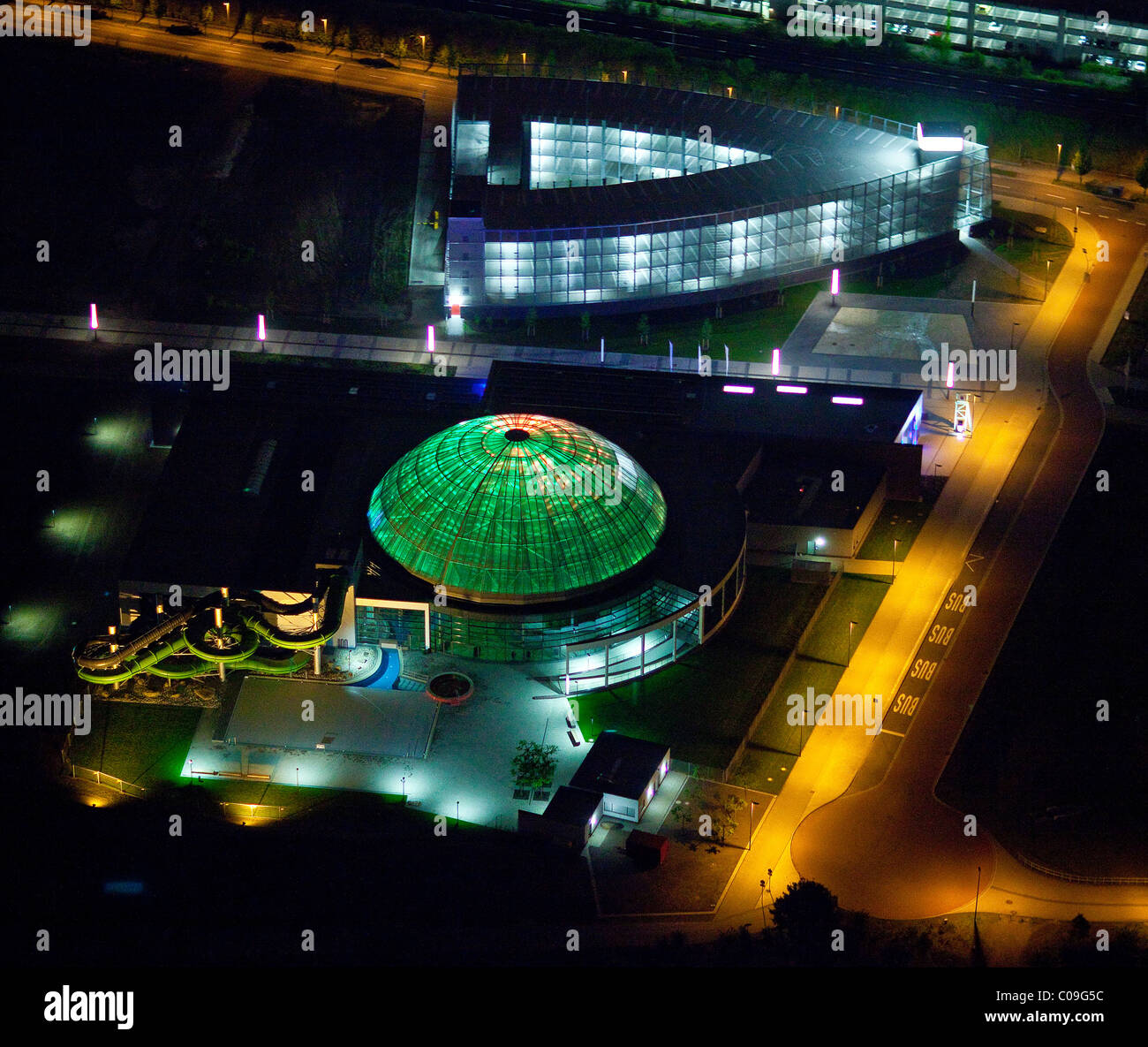 Aerial view, night, new center with gasometer, Centro, new water park, theater at night, Oberhausen, Ruhrgebiet region Stock Photo