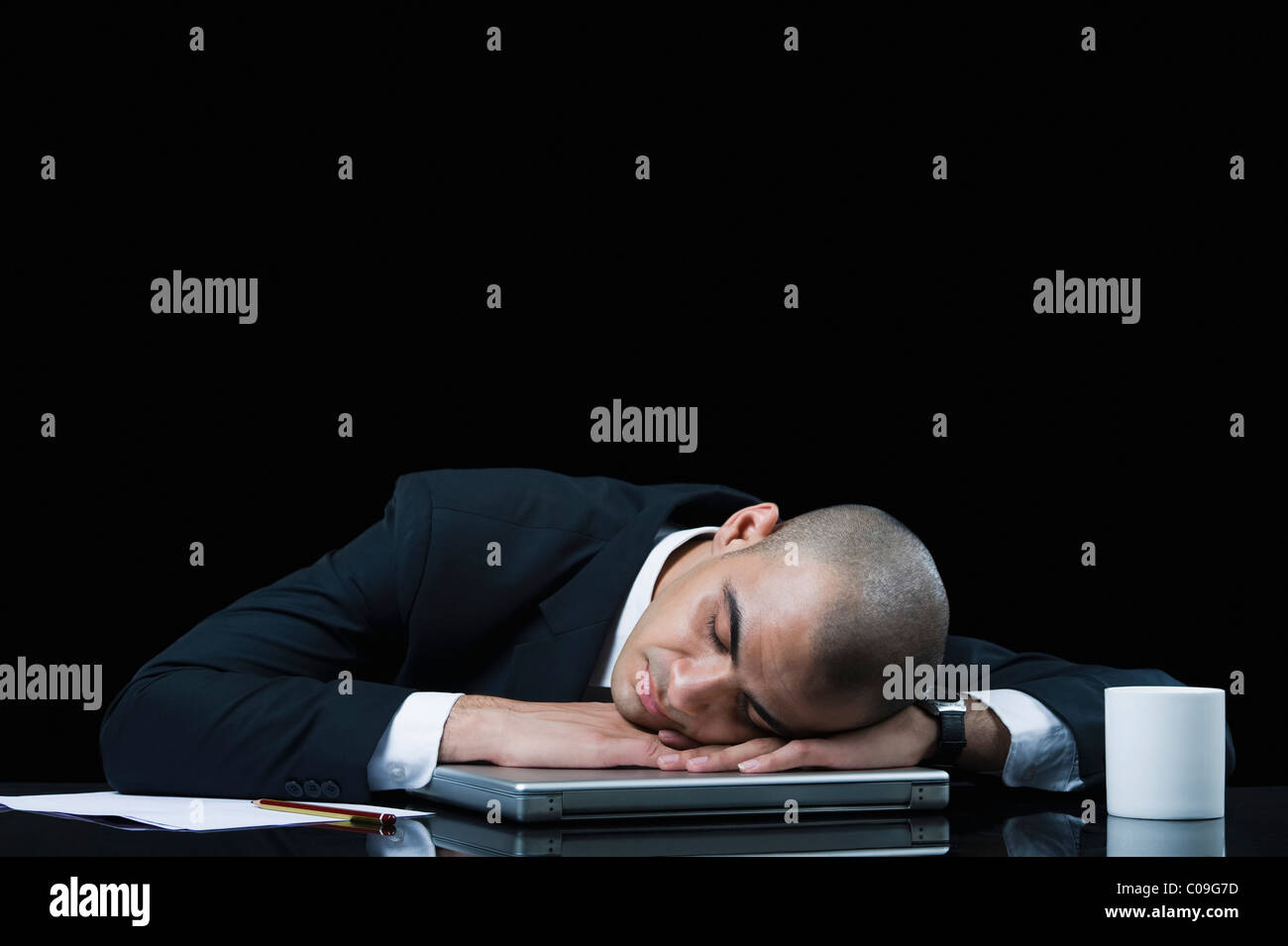 Businessman napping on a laptop Stock Photo - Alamy