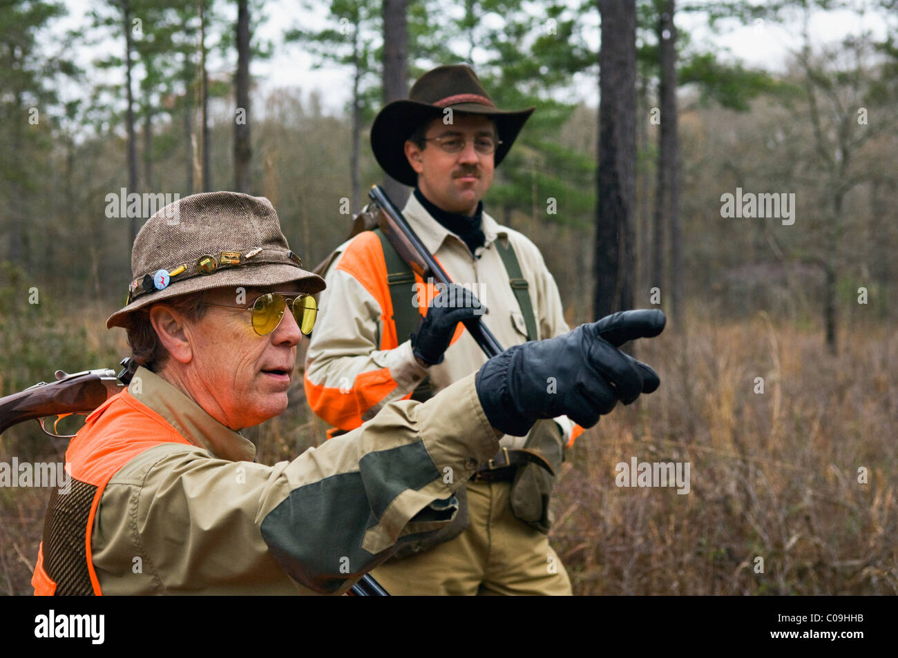 Hunters Discussing Strategy during Bobwhite Quail Hunt in the Piney Woods of Dougherty County, Georgia Stock Photo