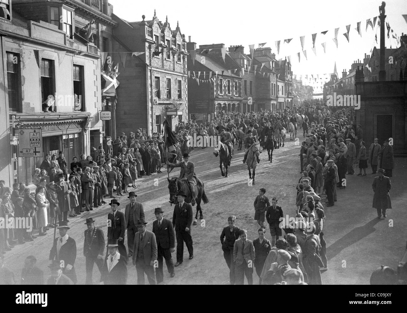 Standard bearer heading out of Market Place Selkirk Common Riding 1949