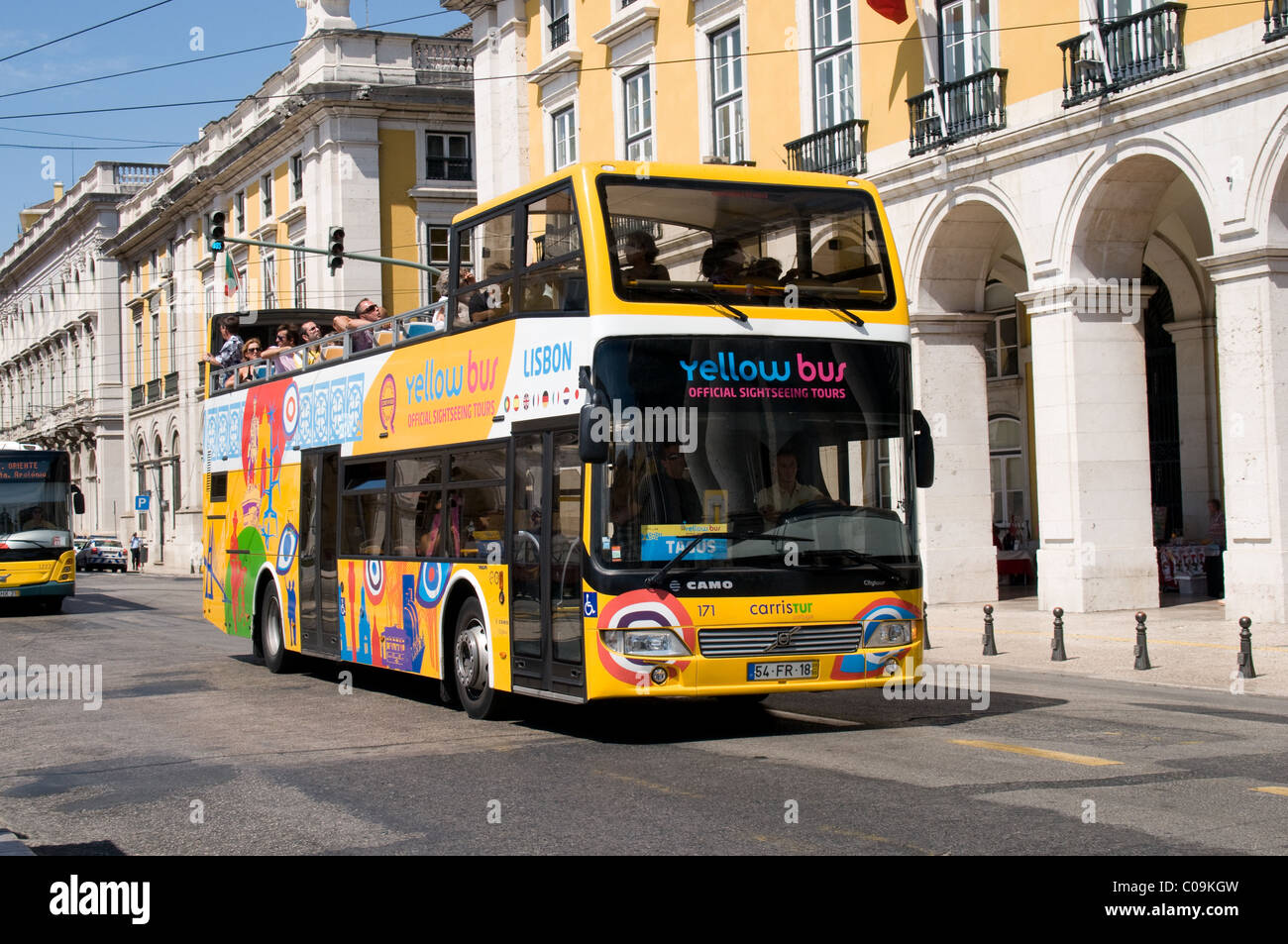 A Carris sightseeing bus reaches Praca do Comercio as part of its tour  around Lisbon Stock Photo - Alamy