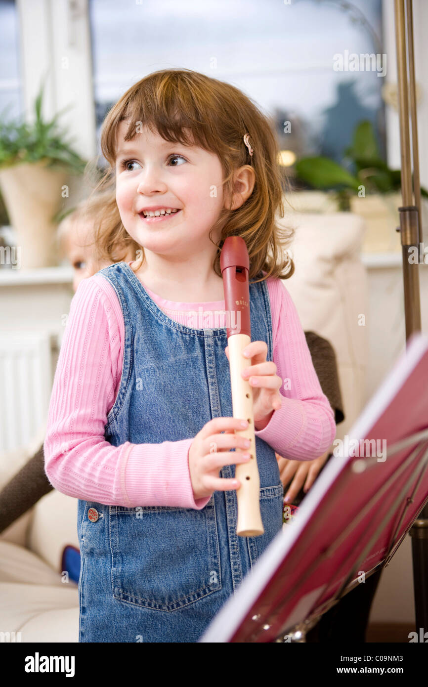 Girl playing a flute Stock Photo Alamy
