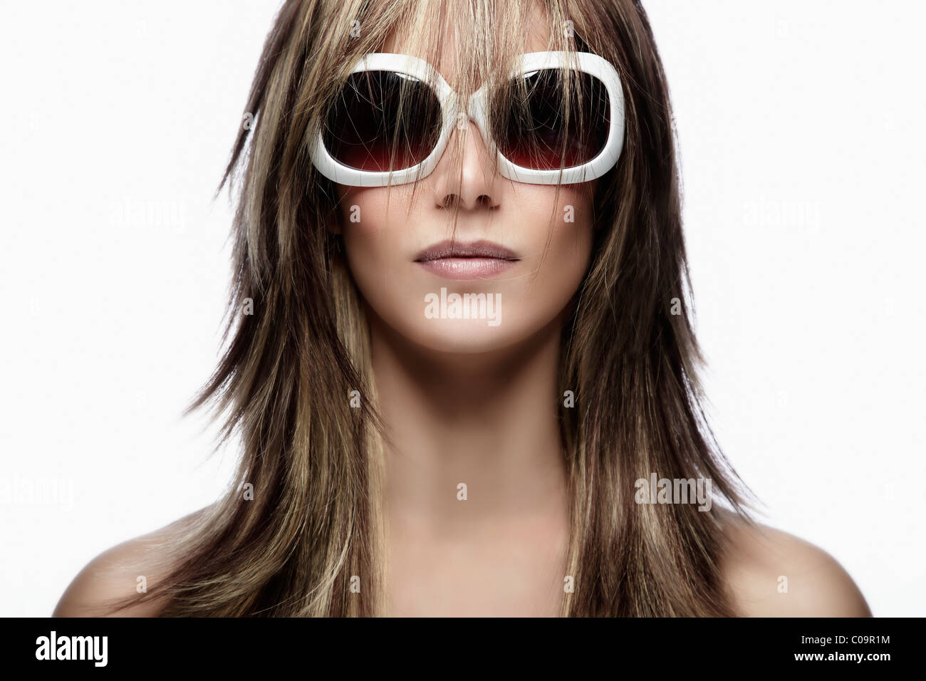 Young woman wearing white sunglasses, portrait Stock Photo Alamy