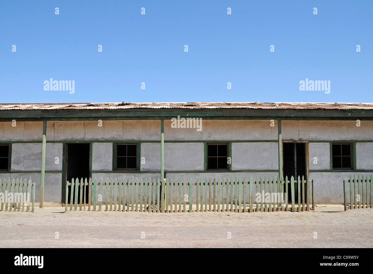 Workers' housing, houses, road, saltpeter, abandoned salpeter town, ghost town, desert, museum, Unesco World Heritage Site Stock Photo