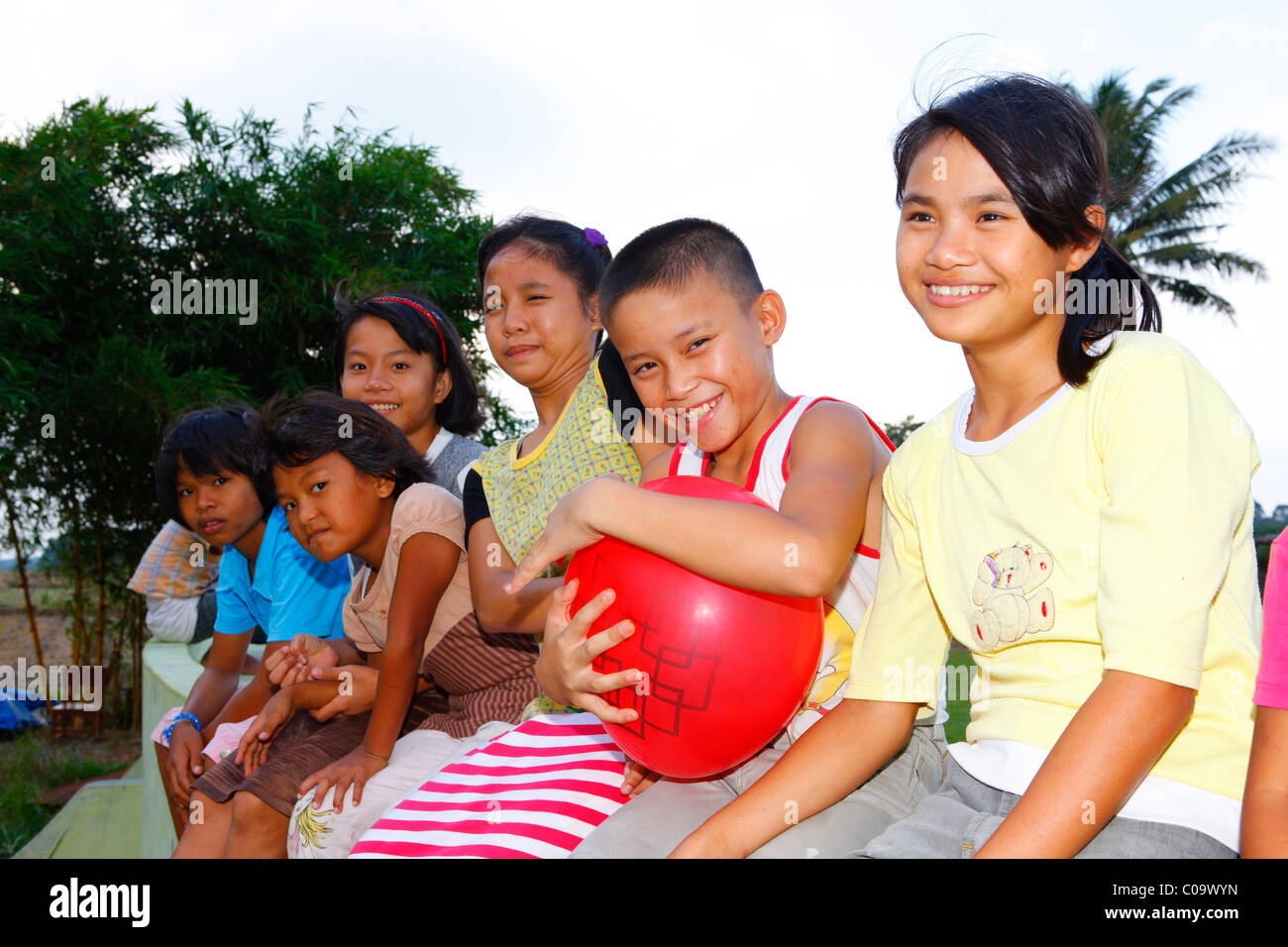 Group of children with a balloon, Margaritha children's home, Marihat, Batak region, Sumatra island, Indonesia, Asia Stock Photo