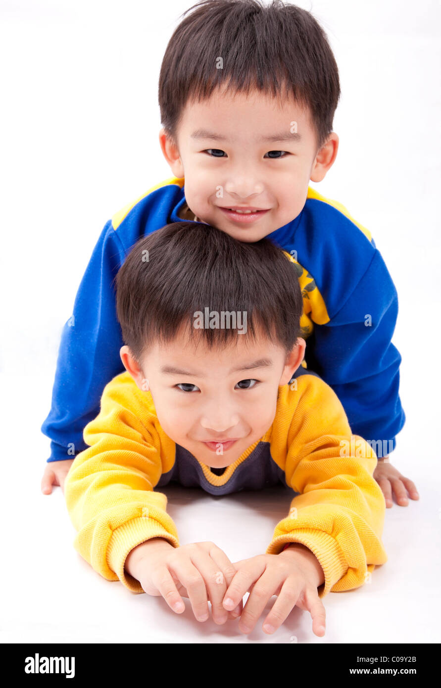 Twin brothers.two happy boys.Isolated with white background. Stock Photo