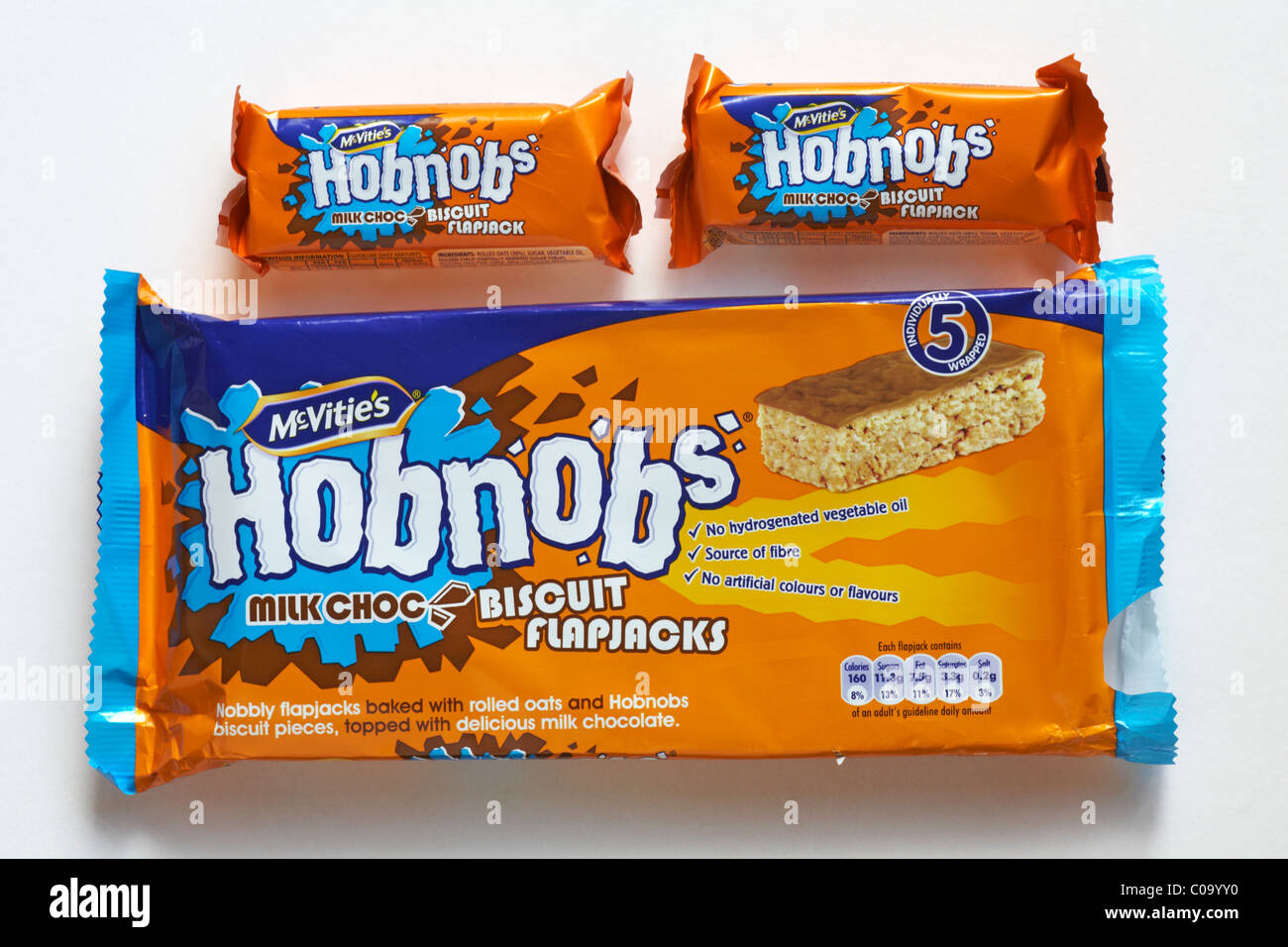 Packet of Mcvitie's Hobnobs milk choc biscuit flapjacks, milk chocolate biscuits with two removed isolated on white background Stock Photo