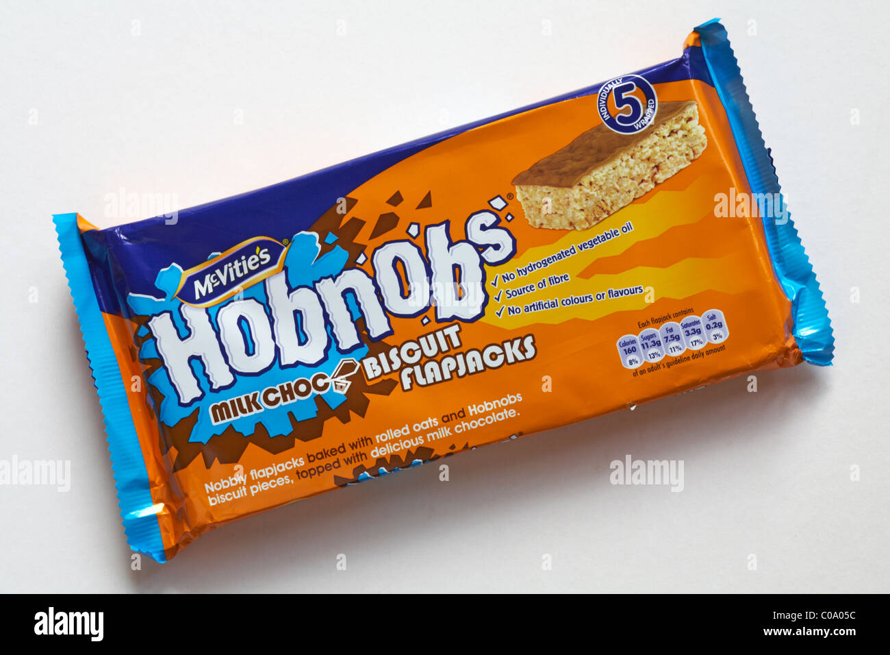 Packet of Mcvitie's Hobnobs milk choc biscuit flapjacks, milk chocolate biscuits isolated on white background Stock Photo