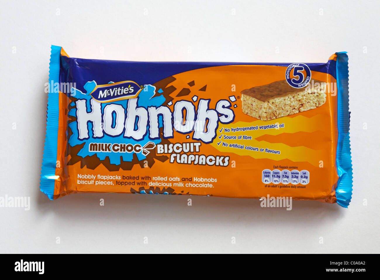 Packet of Mcvitie's Hobnobs milk choc biscuit flapjacks, milk chocolate biscuits isolated on white background Stock Photo