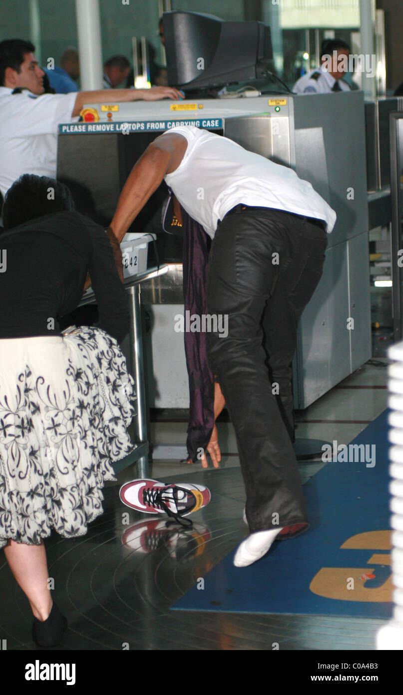 R&B singer Mario Barrett checks in through security at LAX Los Angeles