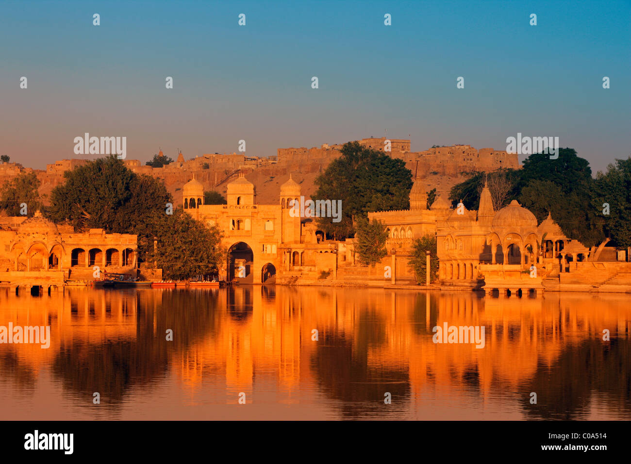 India, Rajasthan, Jaisalmer, Gadisar Lake in the early morning golden light Stock Photo