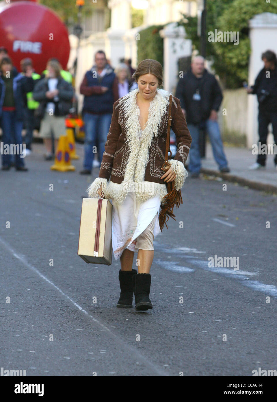 Sienna Miller dressed in vintage clothes and filming a scene for her ...