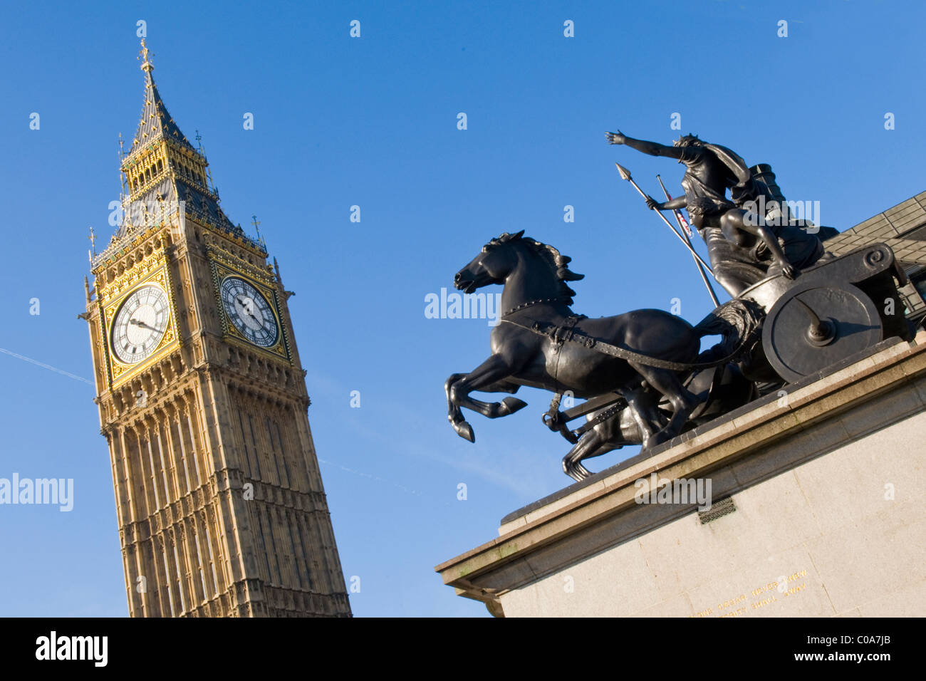 London , Big Ben or St Stephens Tower & bronze statue of Queen Boadicea in war chariot  from Westminster Bridge in winter sun Stock Photo