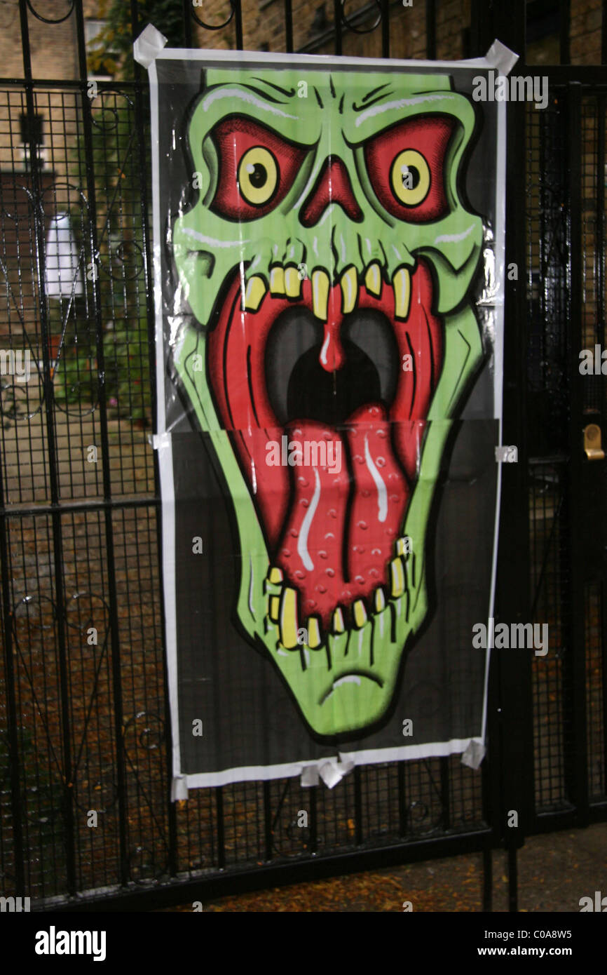 Amy Winehouse and husband Blake Fielder-Civil get into the Halloween spirit by decorating the fence of their London home with a Stock Photo