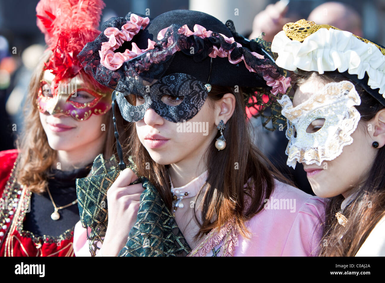 3 Girls in costume at the Venice Carnival Stock Photo - Alamy