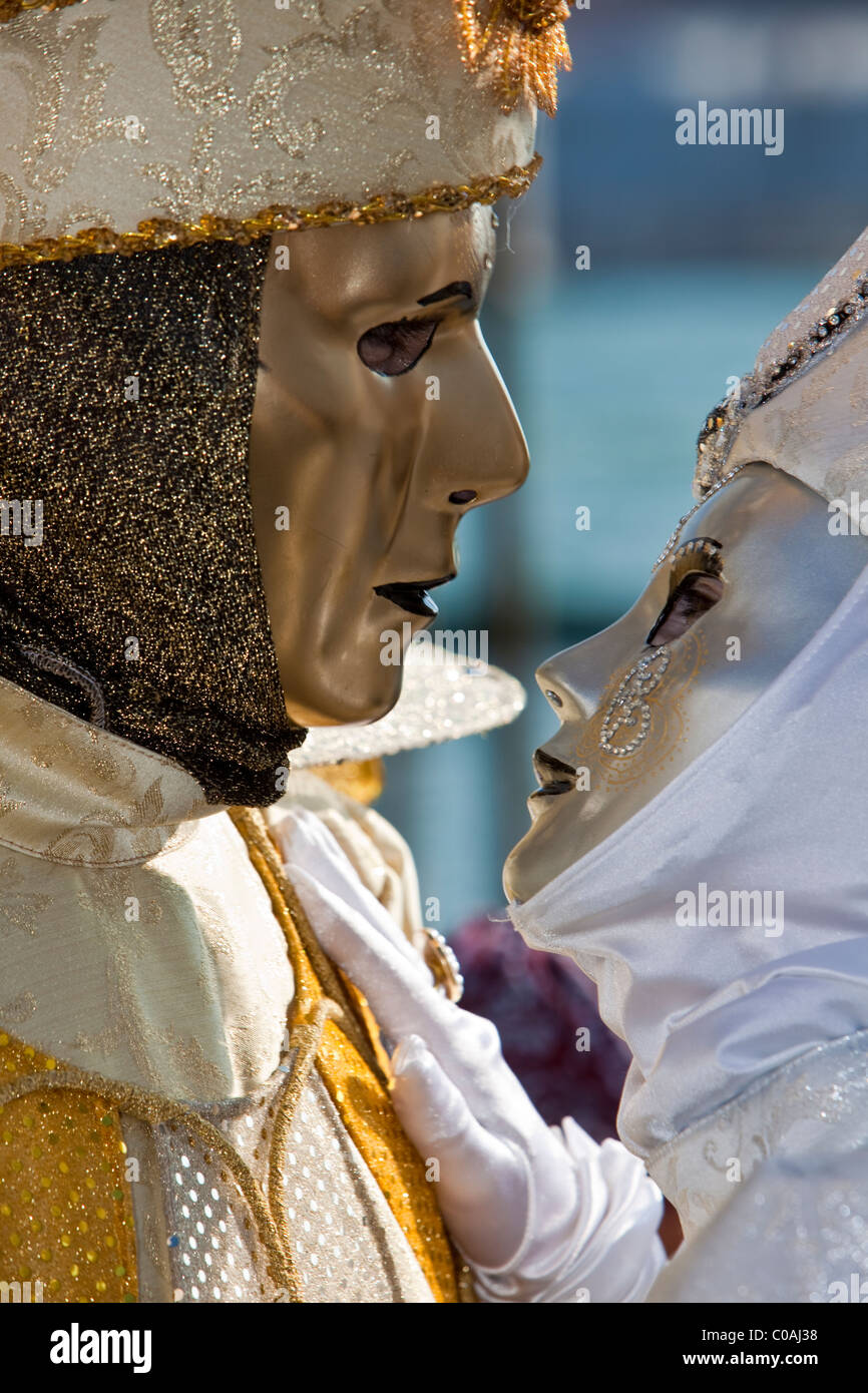 Two people in costume at the Venice Carnival Stock Photo - Alamy