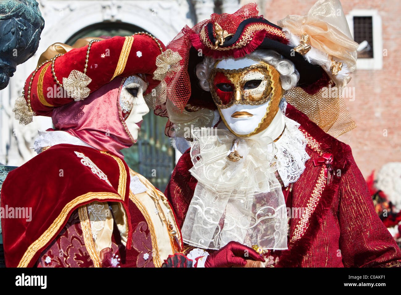 Two people in costume at the Venice Carnival Stock Photo - Alamy