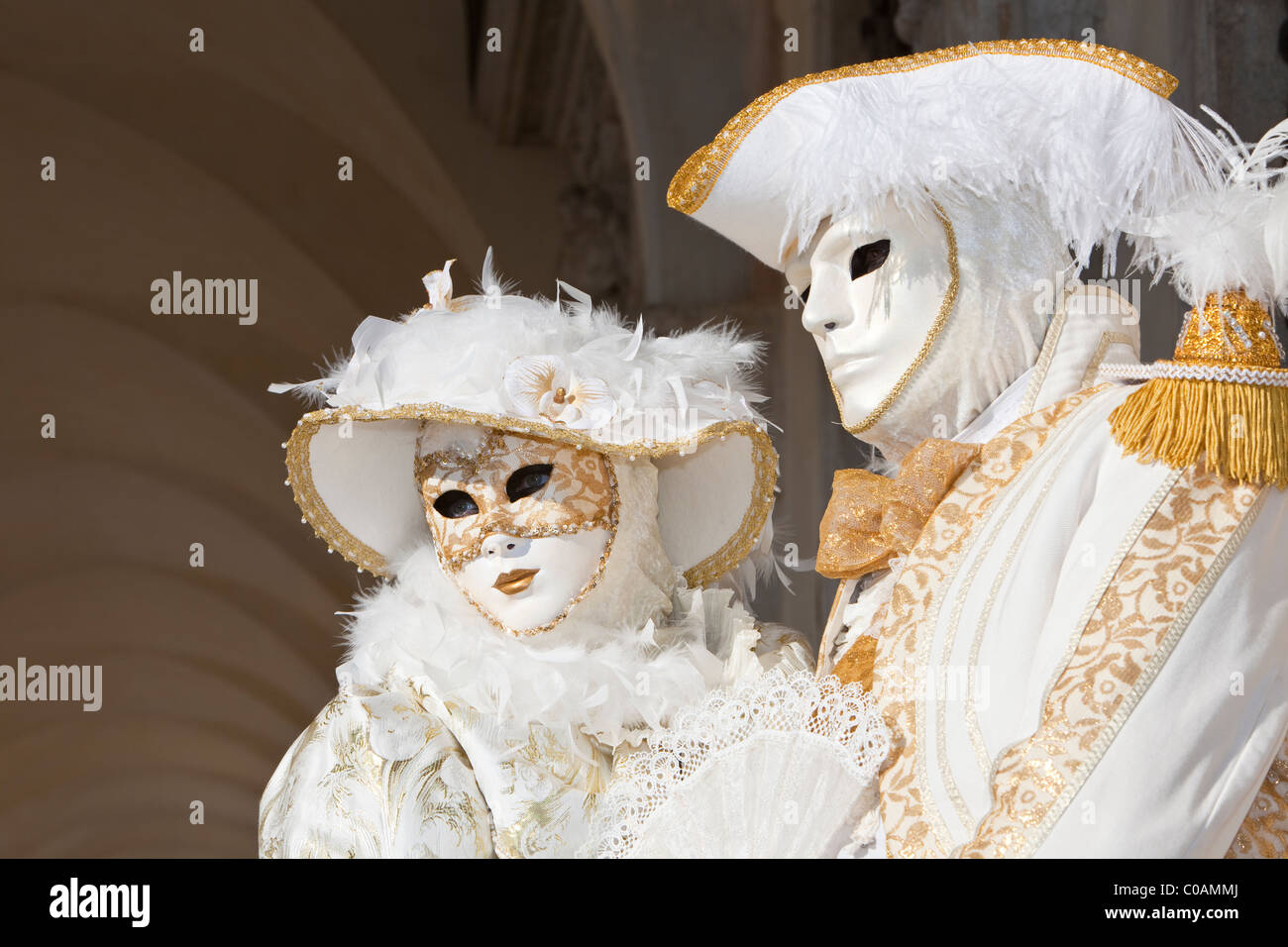 Two people in costume at the Venice Carnival Stock Photo - Alamy