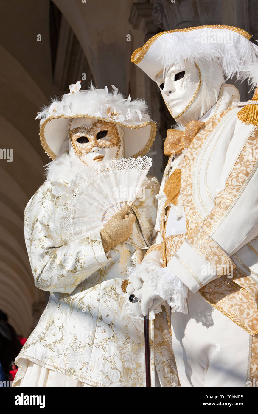 Two people in costume at the Venice Carnival Stock Photo - Alamy