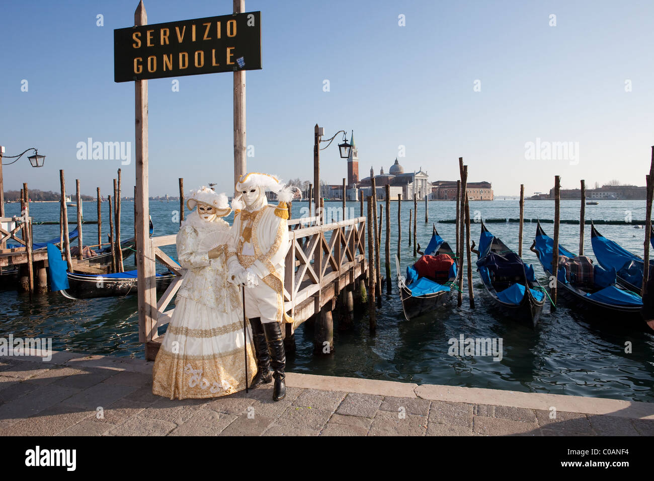 Two people in costume at the Venice Carnival Stock Photo - Alamy