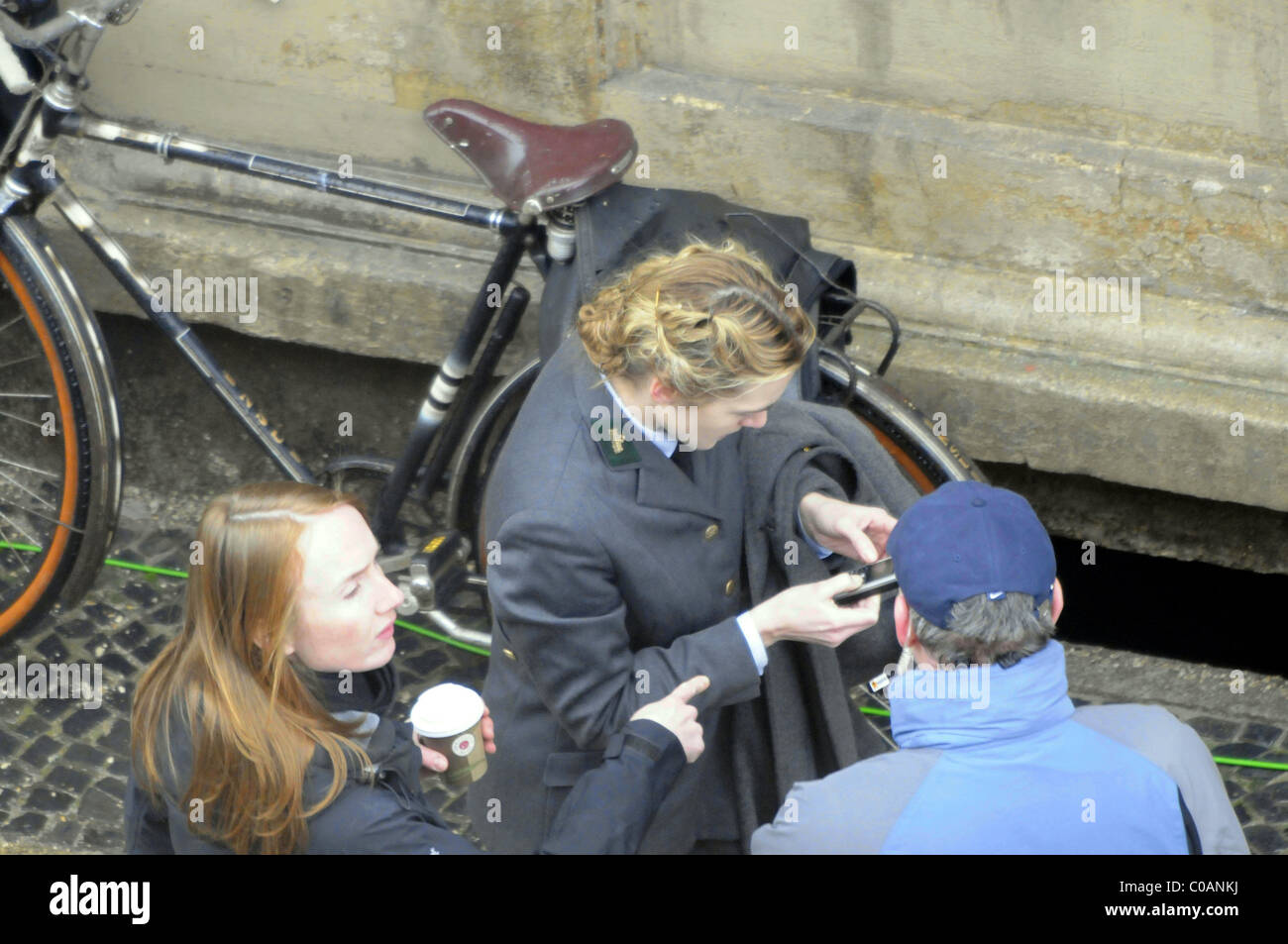 Kate Winslet texting with her mobile phone during a break on the set of  