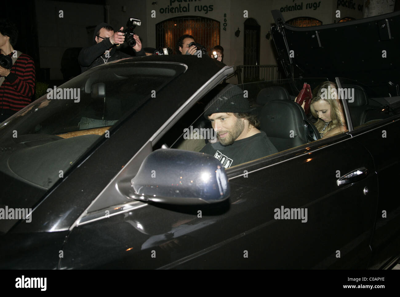 Rick Salomon famed for having relationships with various female  celebrities, showing off to a group of mystery women in his new Stock Photo  - Alamy