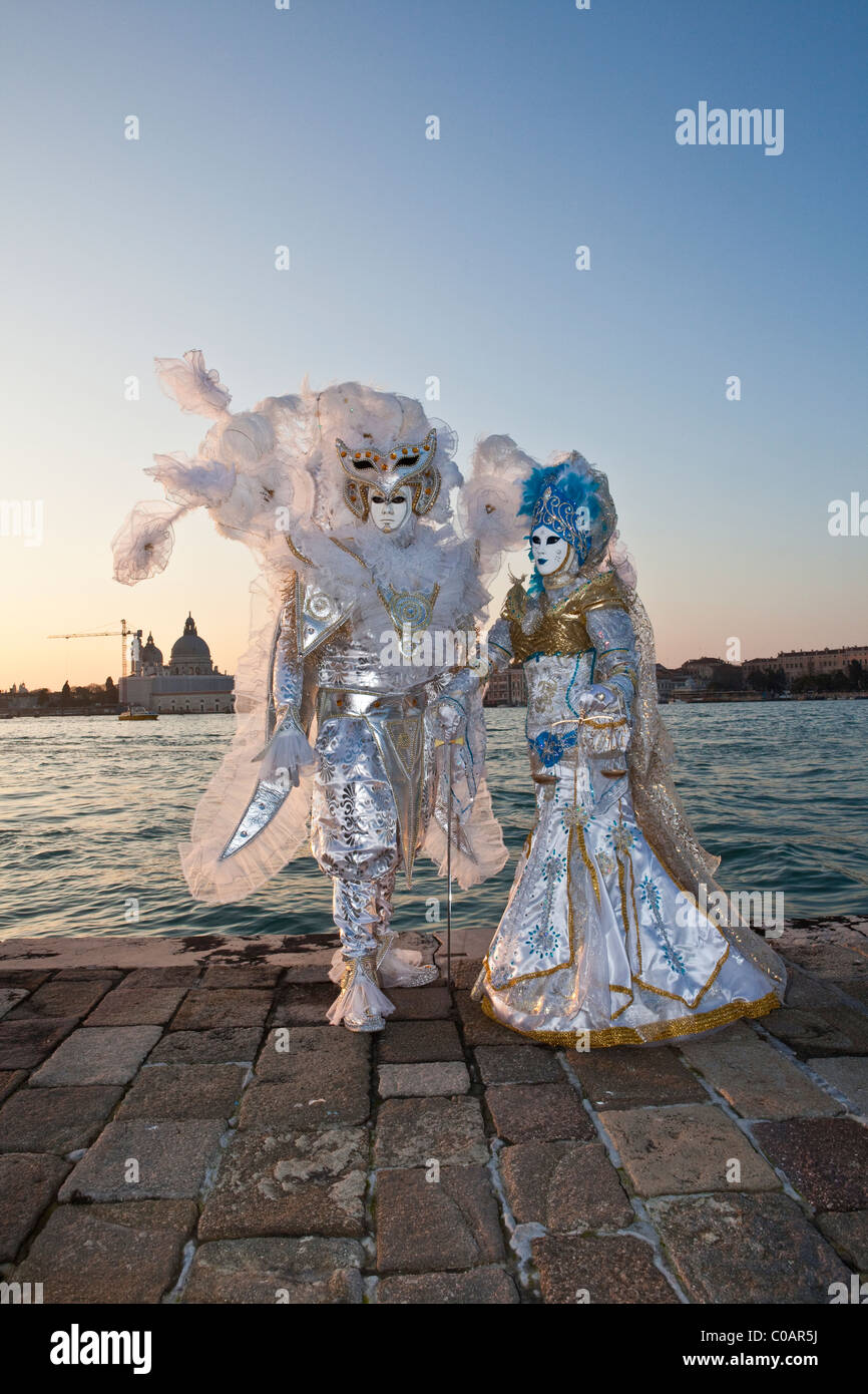 Two people in costume at the Venice Carnival Stock Photo - Alamy