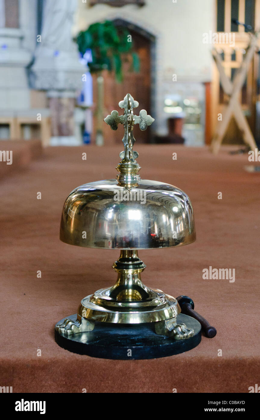 Brass mass bell in a Roman Catholic chapel Stock Photo