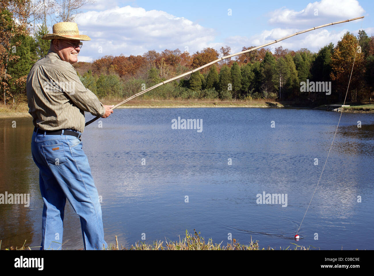 Cane pole fishing hi-res stock photography and images - Alamy