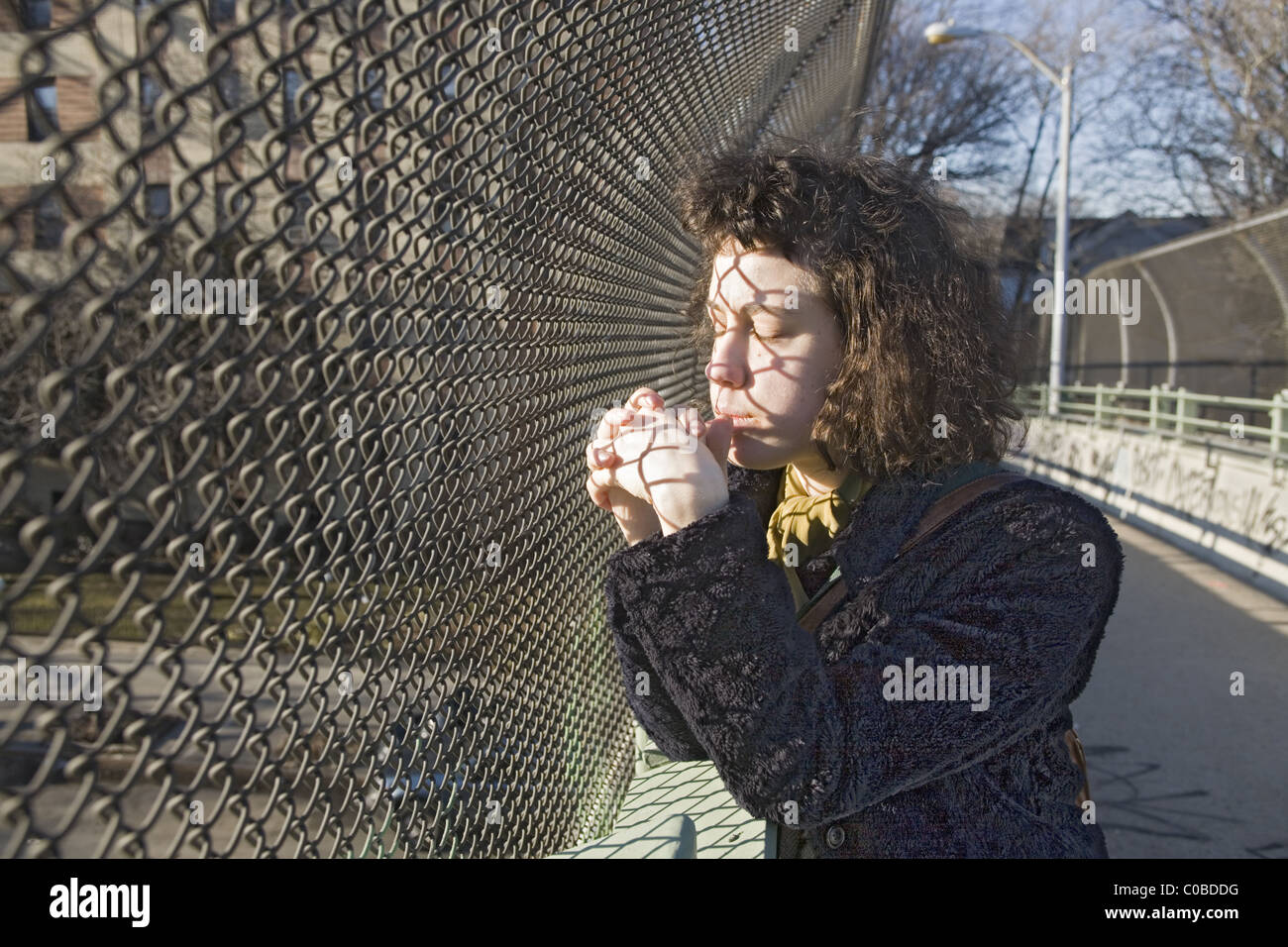 Young woman deep in thought, Brooklyn, New York. Stock Photo