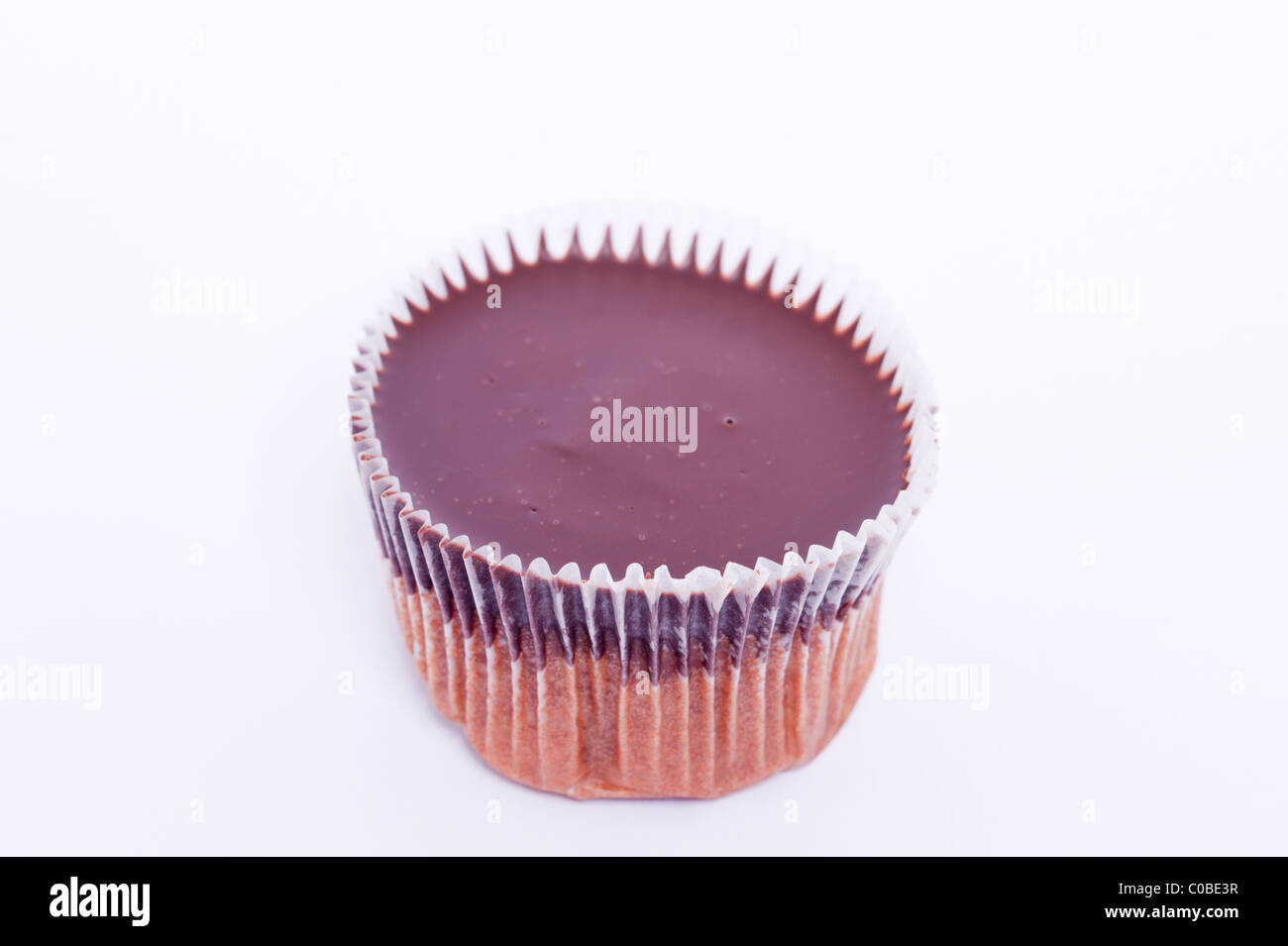 A chocolate cup cake on a white background Stock Photo