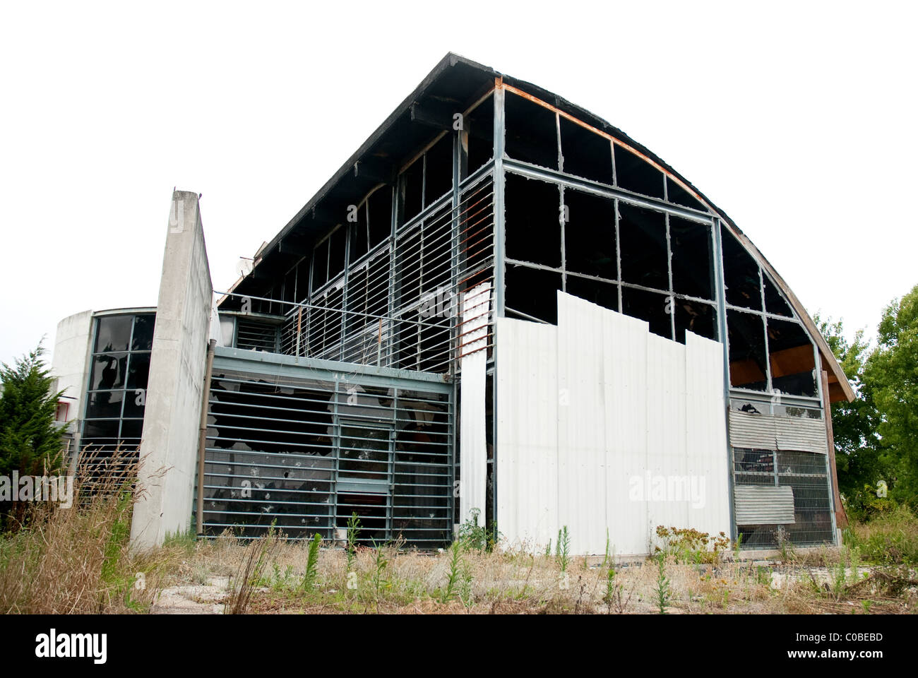 Abandoned modern building with broken windows Stock Photo - Alamy