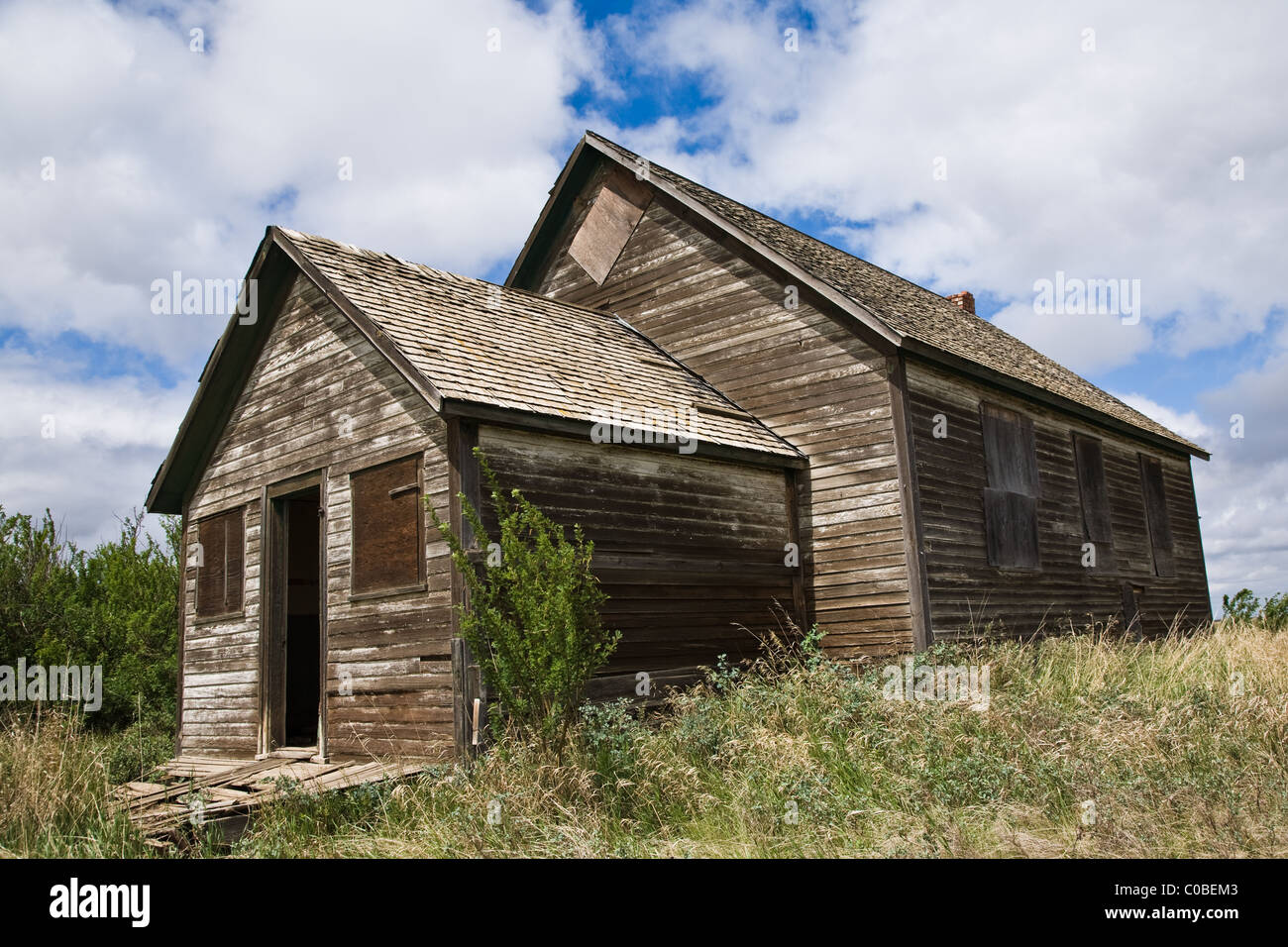 An abandoned one-room school house on the Canadian prairies Stock Photo