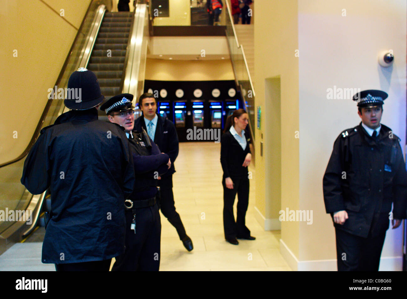 Police and staff close a branch of Barclays Bank on Tottenham Court Road due to a ukuncut protest Stock Photo