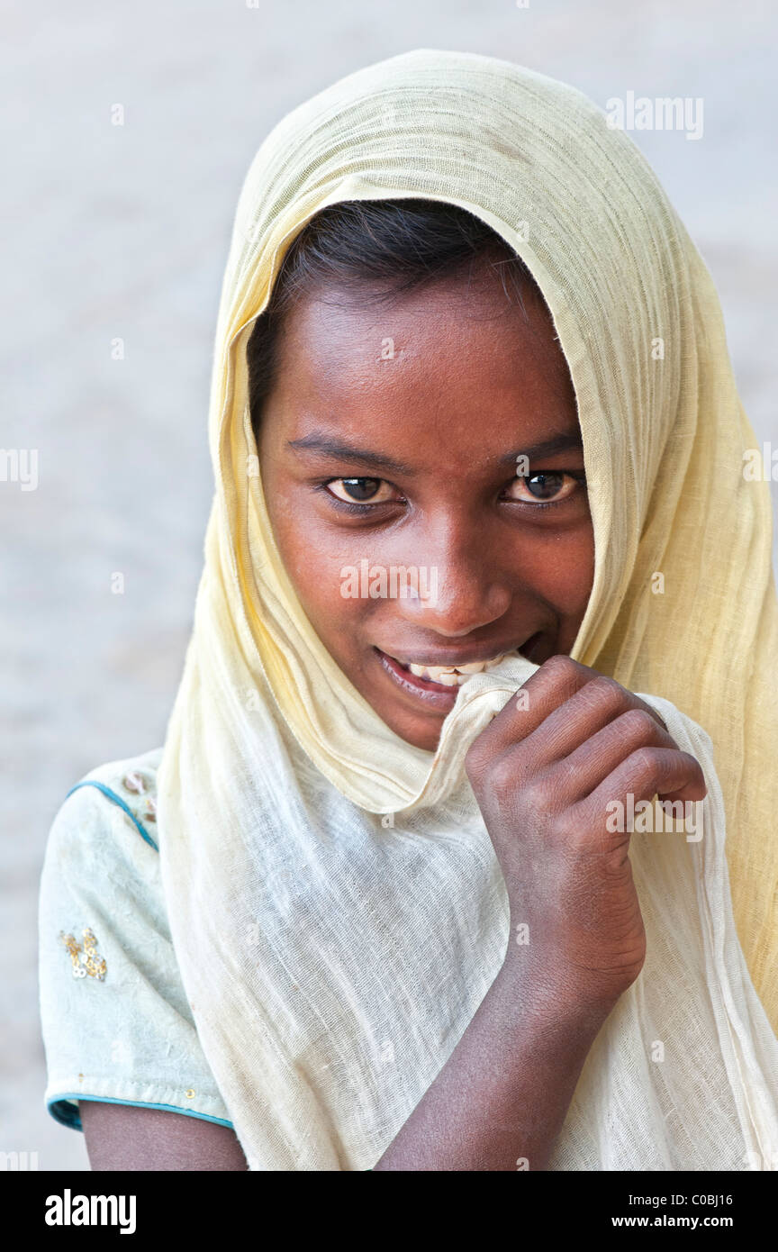 Happy poor lower caste Indian street girl smiling. Andhra Pradesh, India Stock Photo