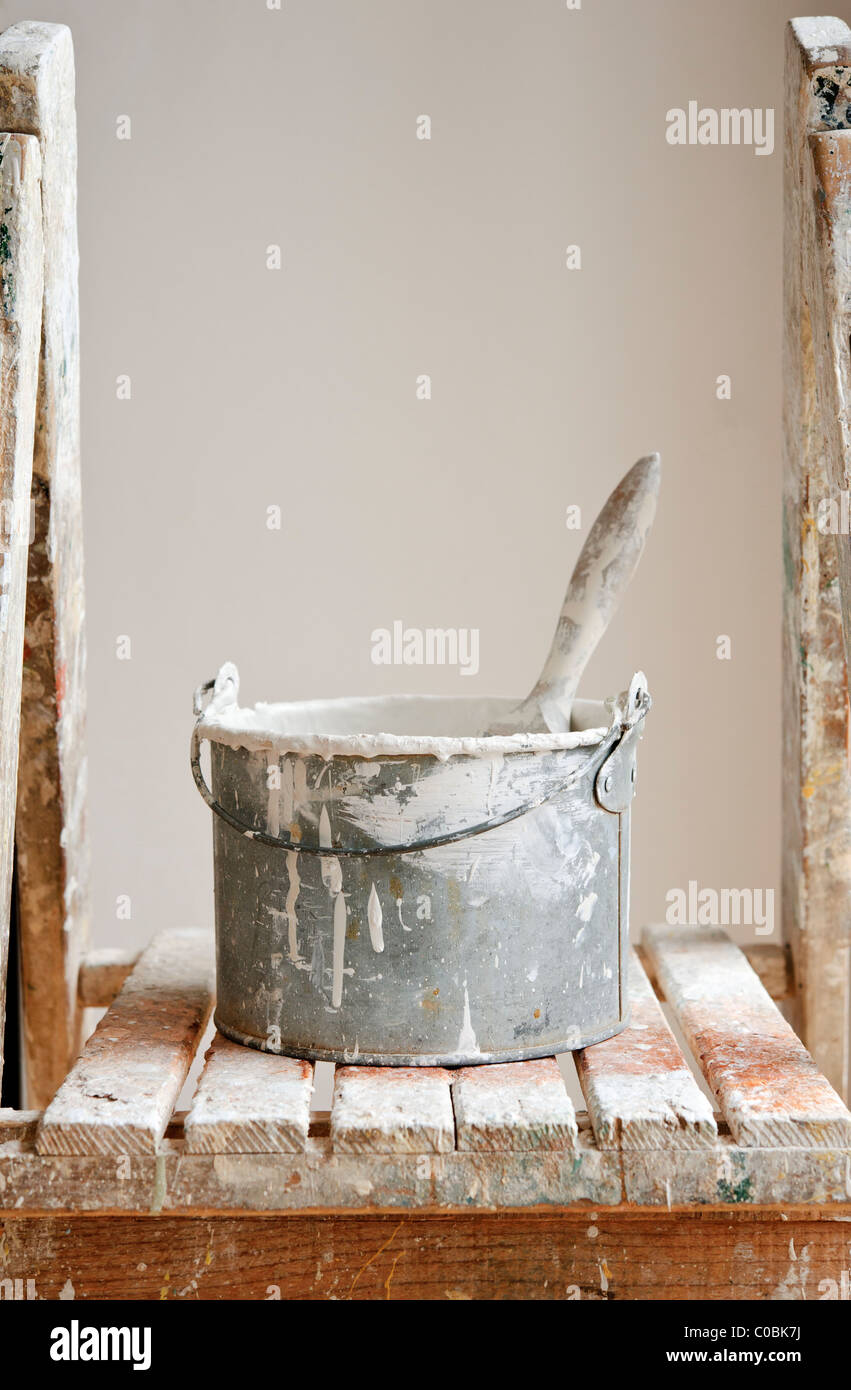 Paint kettle and brush Stock Photo Alamy
