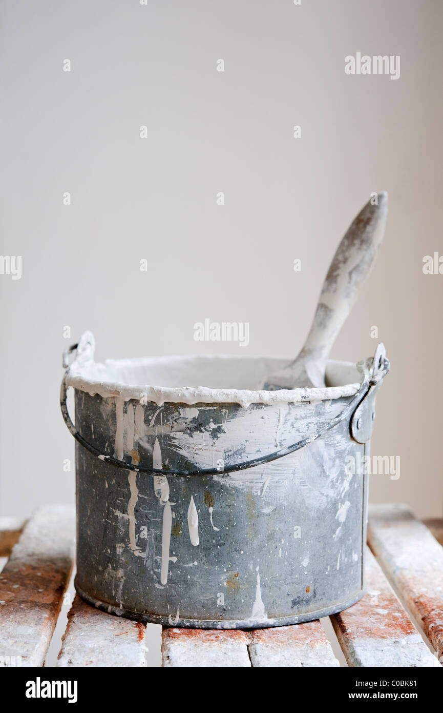 Paint kettle and brush Stock Photo Alamy
