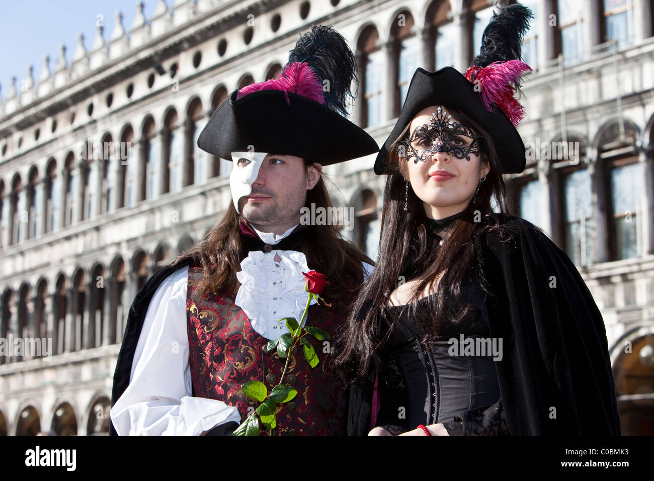 Two people in costume at the Venice Carnival Stock Photo - Alamy