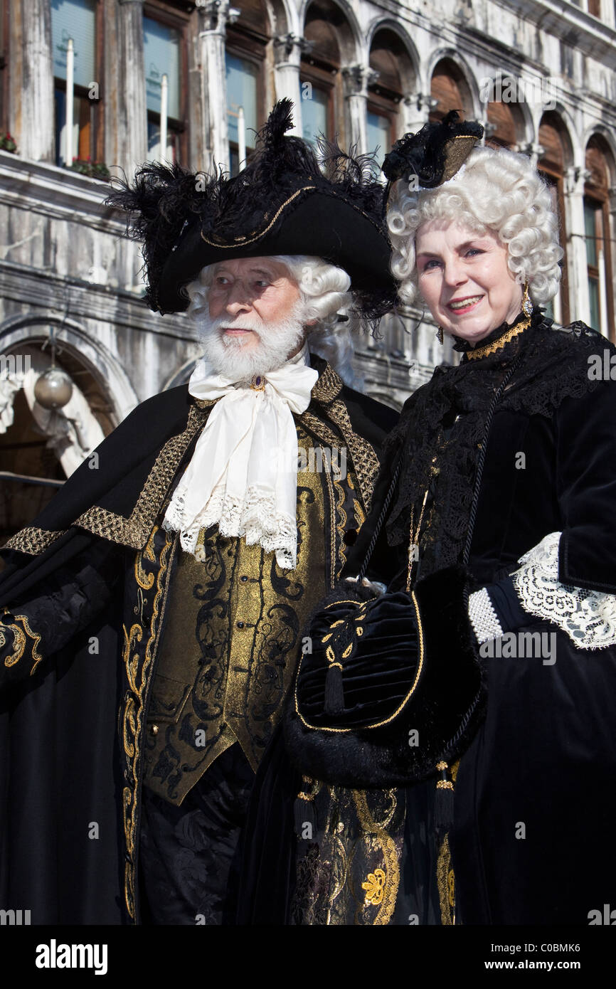 Two people in costume at the Venice Carnival Stock Photo - Alamy