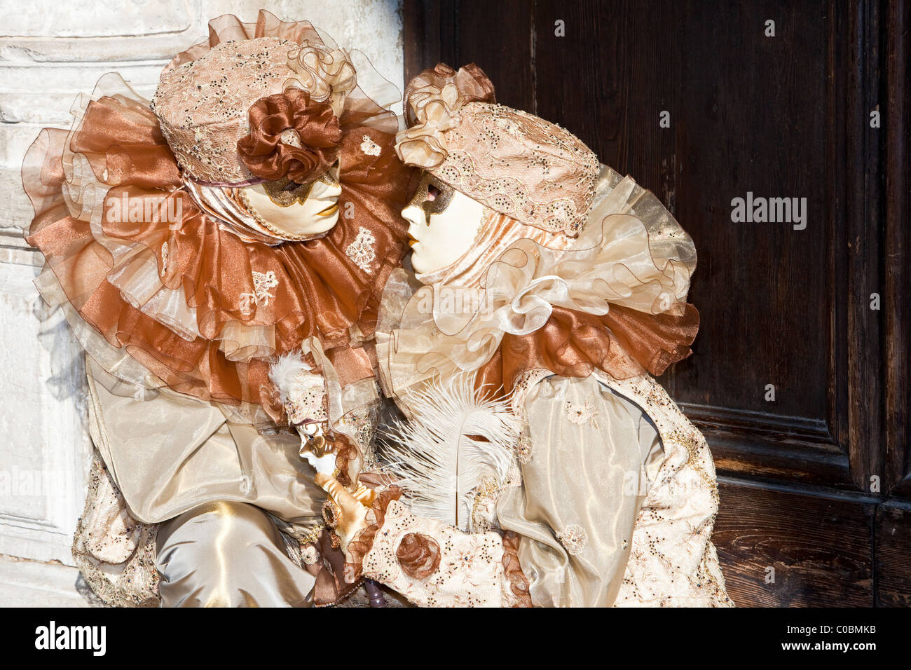 Two people in costume at the Venice Carnival Stock Photo - Alamy