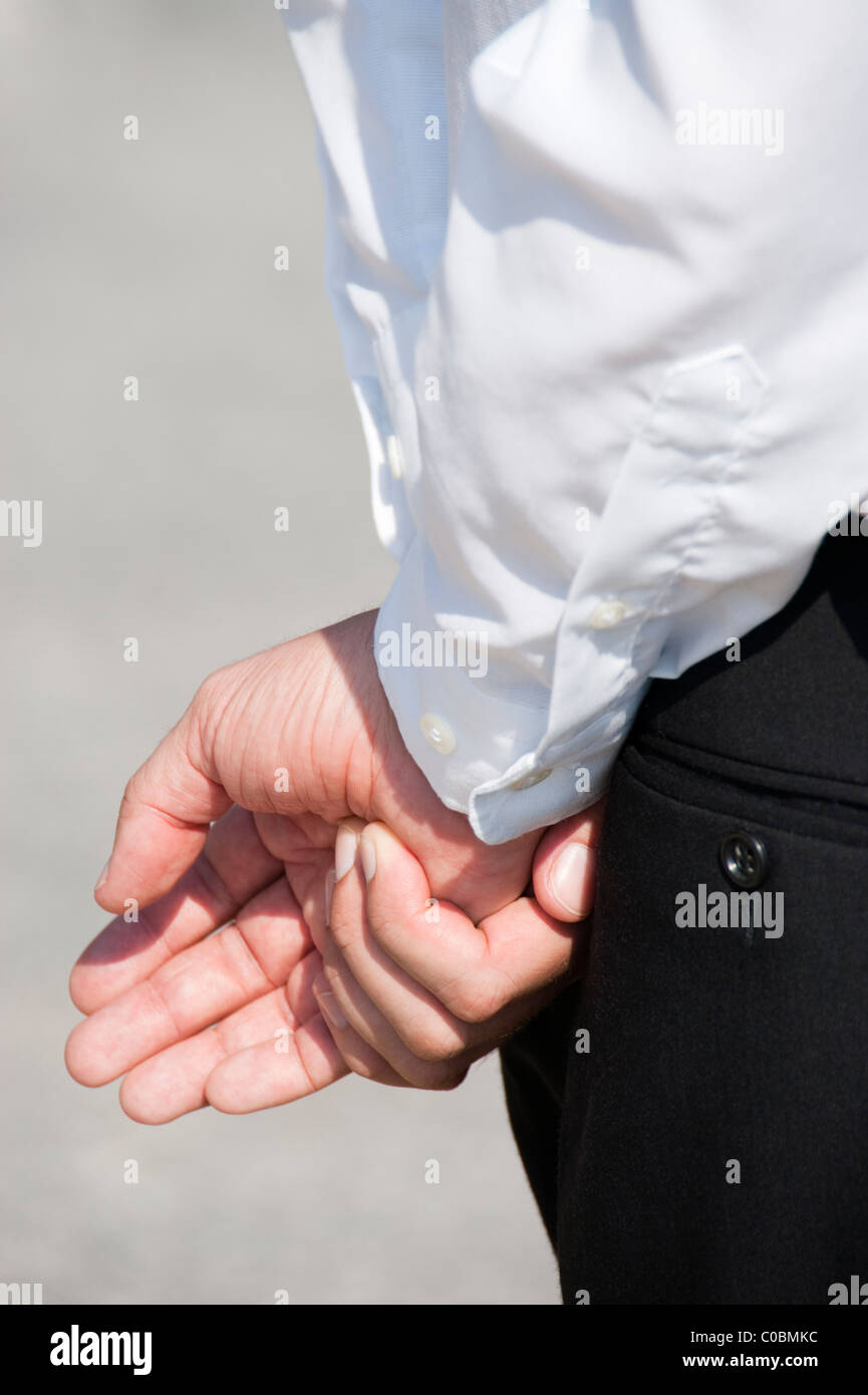 Man hands behind back side view hires stock photography and images Alamy