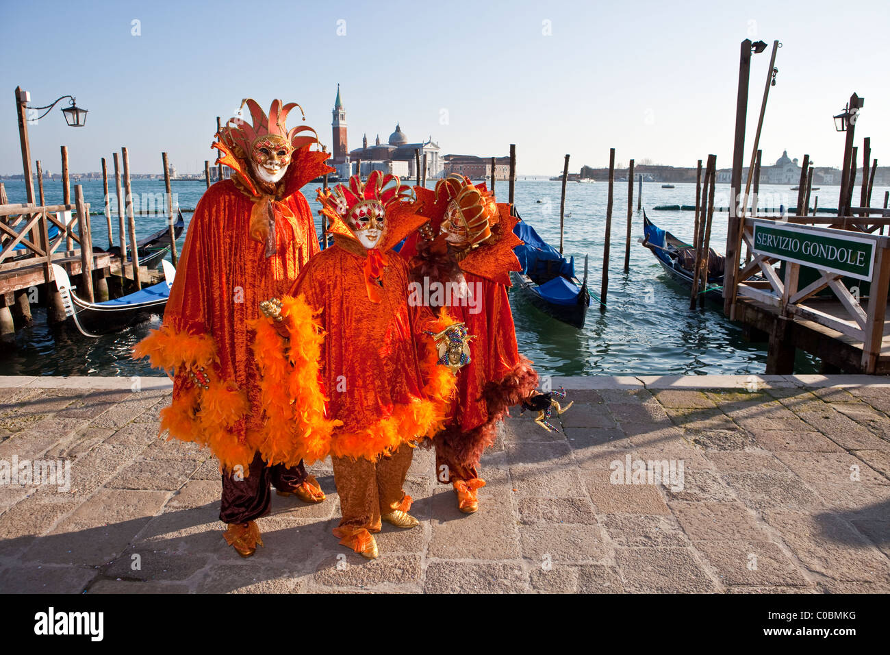 Three people in costume at the Venice Carnival Stock Photo - Alamy