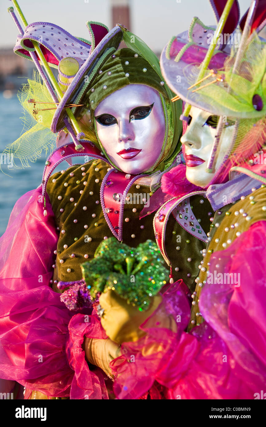 Two people in costume at the Venice Carnival Stock Photo - Alamy