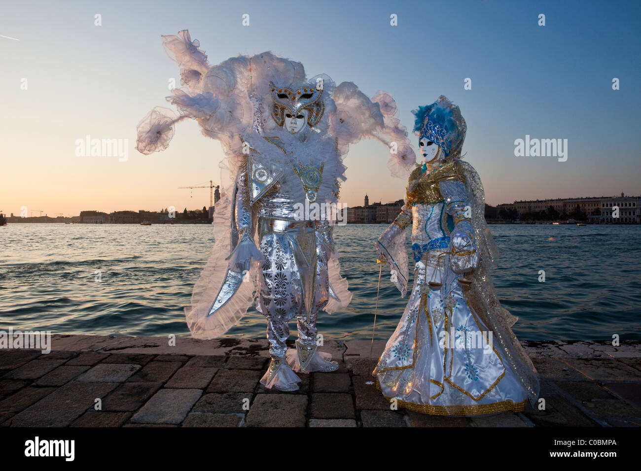 Two people in costume at the Venice Carnival Stock Photo - Alamy